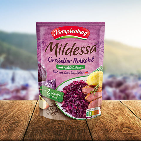 Hengstenberg Mildessa Genieöser Rotkohl package on a wooden surface with a blurred outdoor background